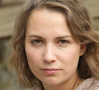 Neutral portrait of woman representing TheraPexa customer sharing results from neck and shoulder massager